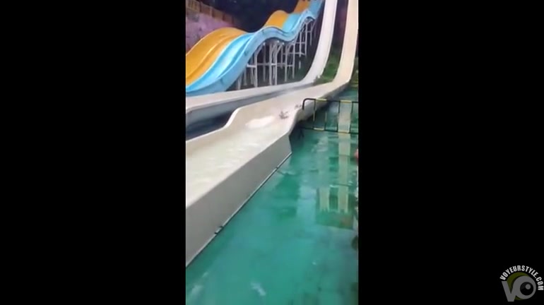 Small breasts exposed on the water slide