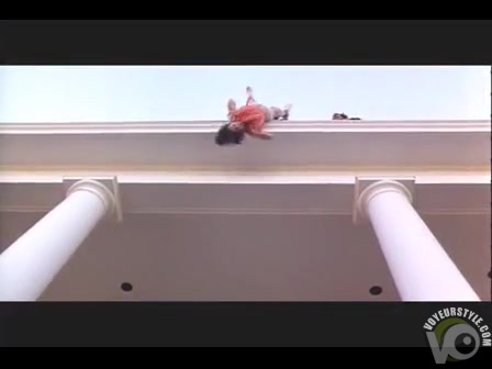 Woman in a dress dangled off the roof