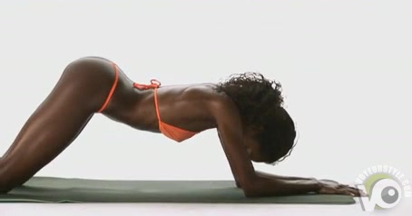 Ebony model stretches her flexible curves