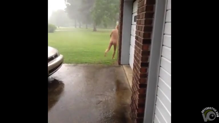 Naked girlfriend runs outdoors in a hurricane