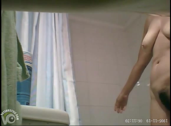 Large-breasted mature beauty goes to take a shower