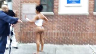 Crazy madam with a massive behind stands on the middle of the sidewalk--_short_preview.mp4