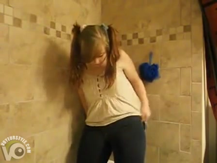 Fat ass cutie pisses her jeans in the tub