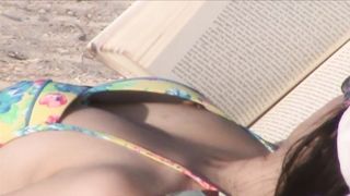 Sexy brunette sunbathes her body on the beach--_short_preview.mp4