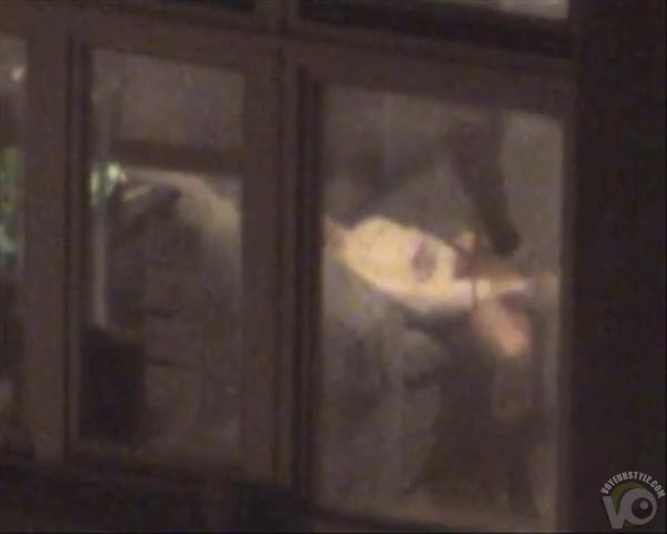 Lovely babe filmed masturbating through apartment window