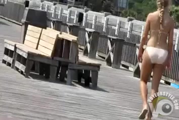 Bikini girls with beautiful butts on the boardwalk