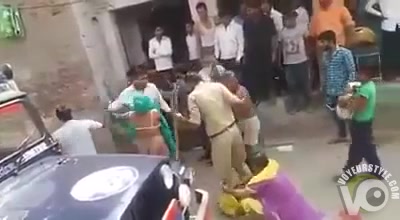 Street fight with a naked female ass