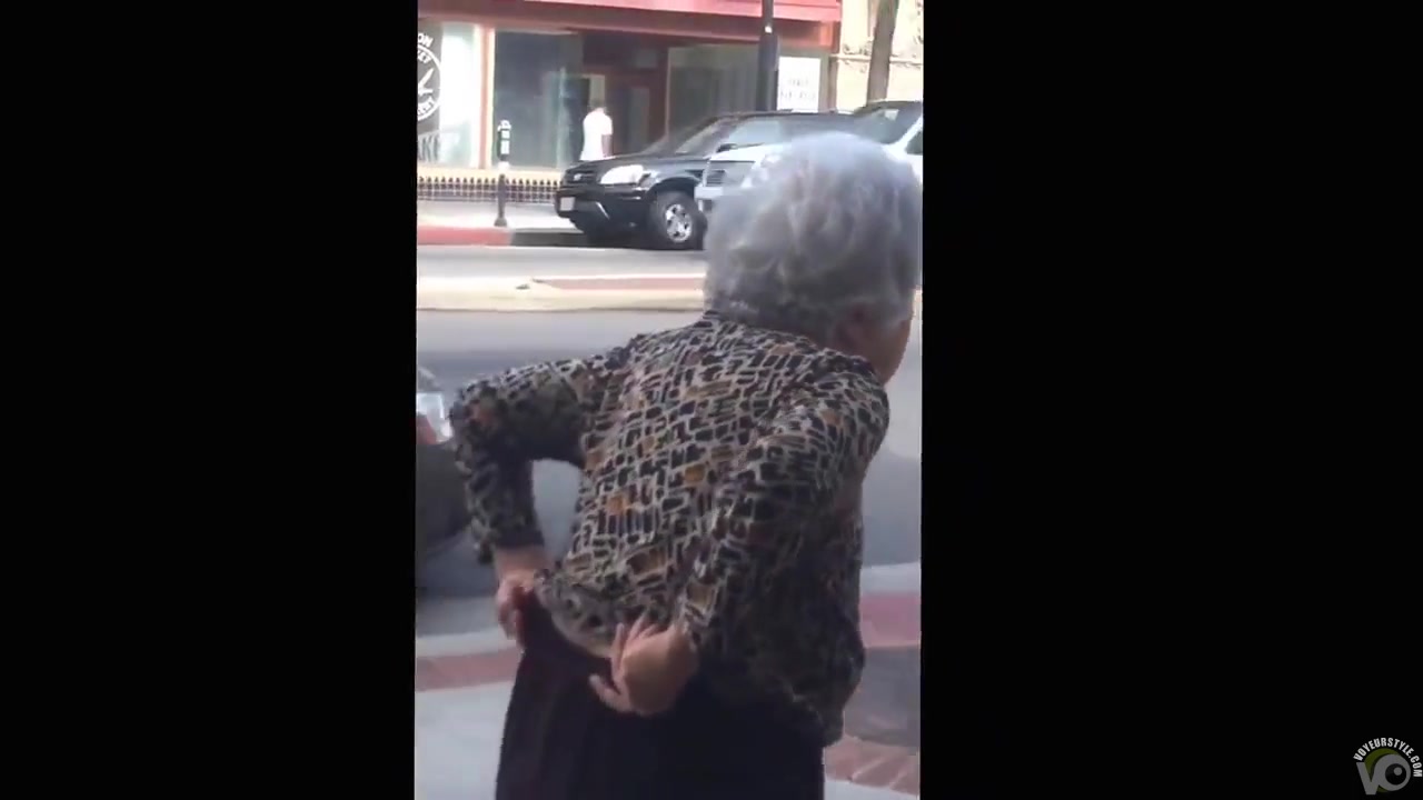 Old lady took a slash on the street chair