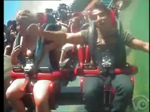 Roller coaster ride makes her big tits pop out.