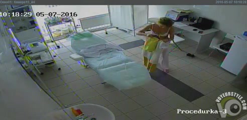 Mature beauty changes her clothes in the procedure cabinet