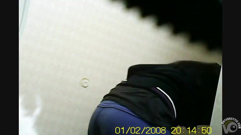 Lovely coed caught on a bathroom hidden cam