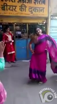 Stunning Indian woman dances around with one of her tits out