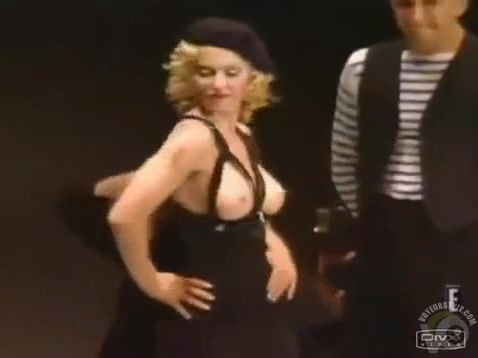 Madonna topless at a fashion show and loving it