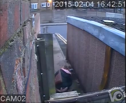 Security camera catches a babe taking a pee