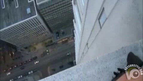 Outdoor blowjob on the ledge of a very tall building