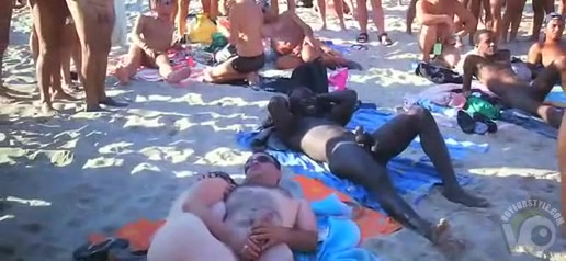 Nudist orgy at the beach with an audience
