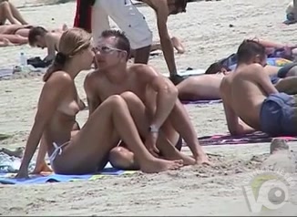 Crowded topless beach has lots of tits to admire