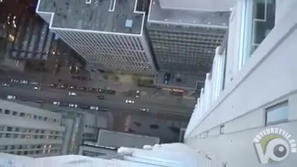 Daring blowjob on the ledge of a skyscraper
