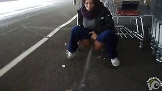 German girl pisses in the cart parking area at a store--_short_preview.mp4