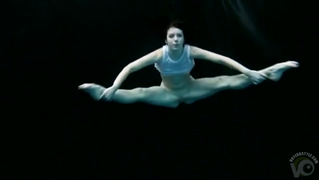 Flexible young swimmer in solo underwater video