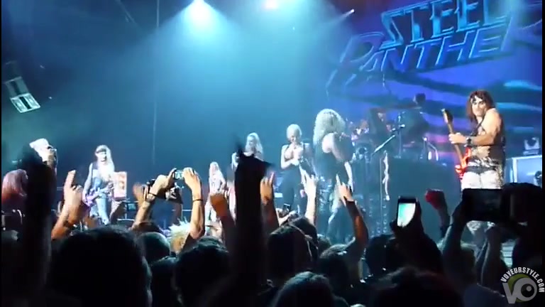 Groupies dancing and stripping at a hair metal show