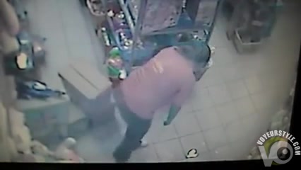 Woman pees on the floor in a store
