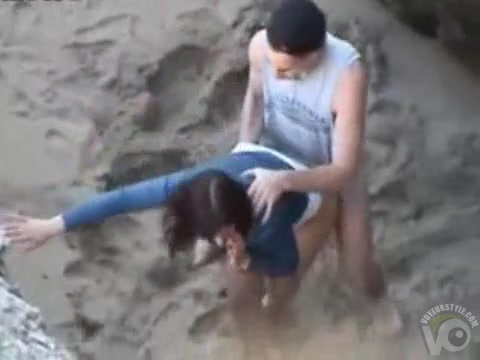 Hot young brunette fucked at the beach