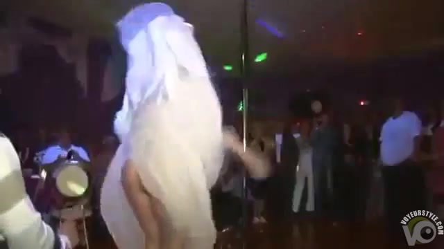 Foxy slim blonde performs a sensual striptease in a wedding dress