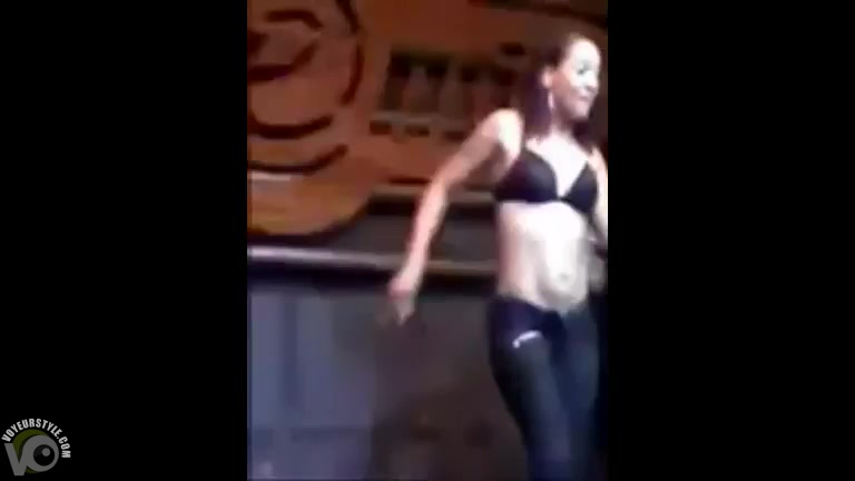 Party girls dancing and stripping on stage