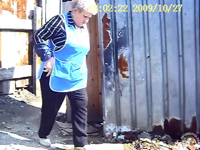 Granny takes a quick piss outdoors