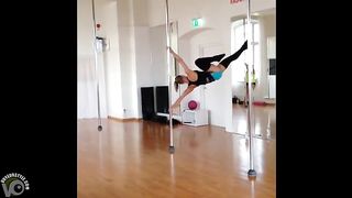 Stunningly fit girl swings around the pole--_short_preview.mp4