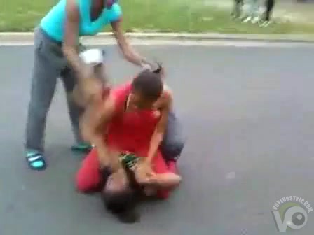 Black maids throwing punches in the street