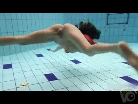 Artful naked swimming with a skinny girl