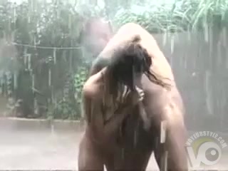 Simultaneous oral sex outdoors in the rain