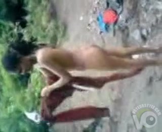 Naked Indian amateur teen swims in the river