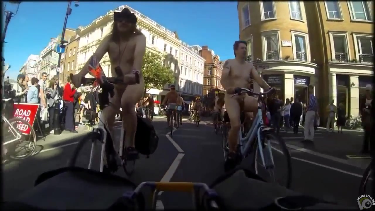 Group of nudists cycle through a town in their birthday suits