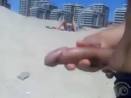Masturbating to a stranger on the beach