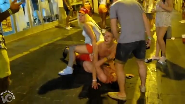 Students mess with a drunk frat boy in the city street