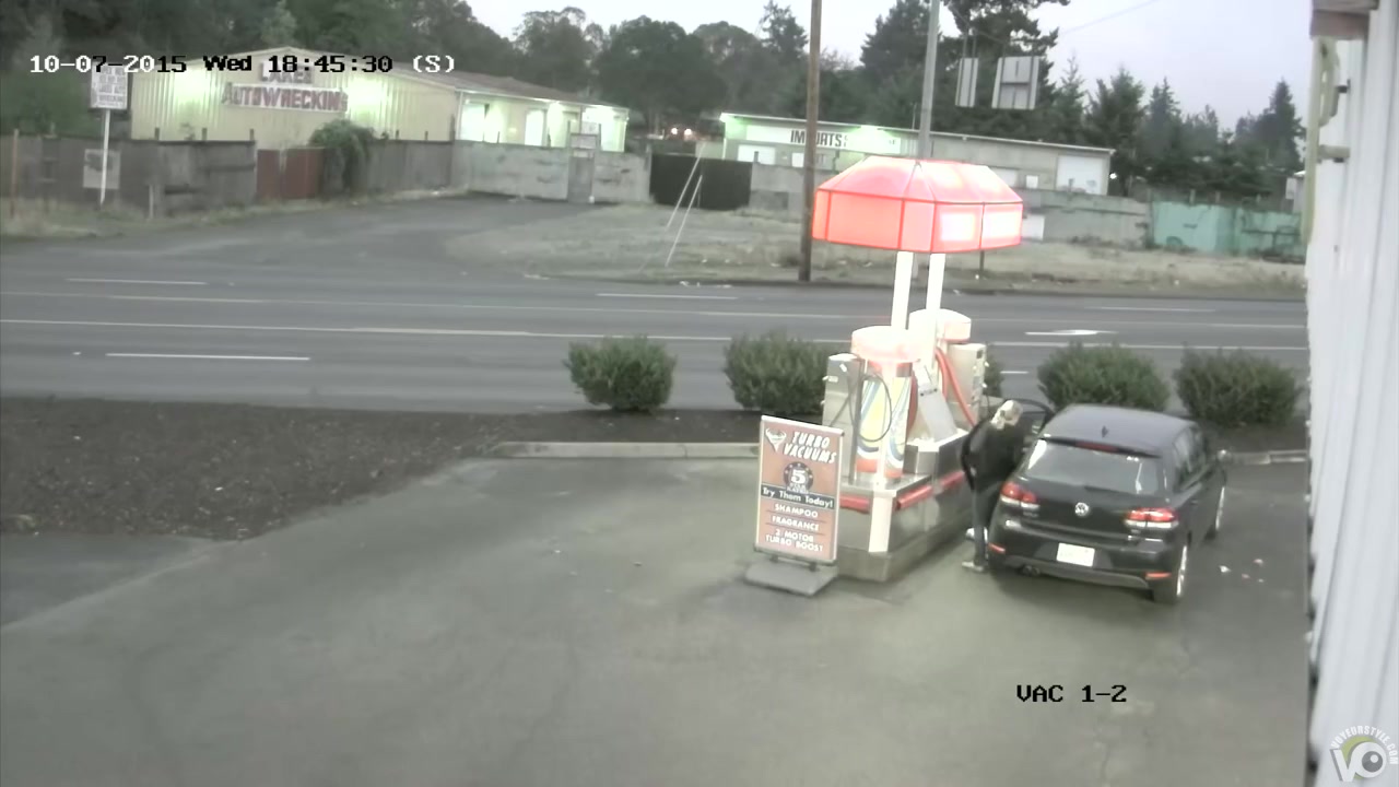 Desperate traveler soaks the road asphalt at the gas station