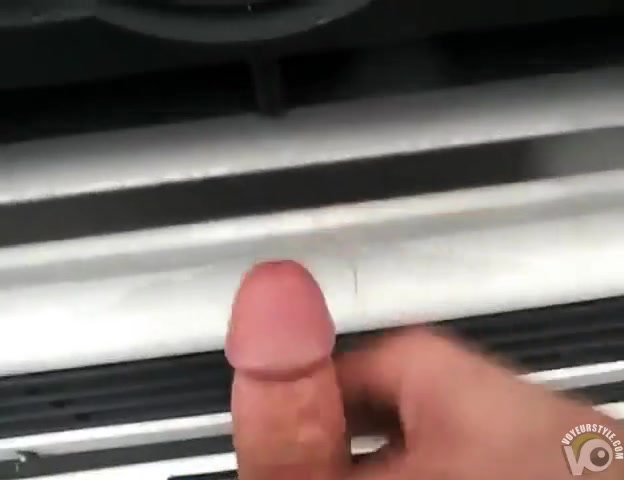Cumming on a truck in a parking lot