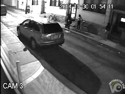 NYC prostitute hides behind a big car to relieve her bladder