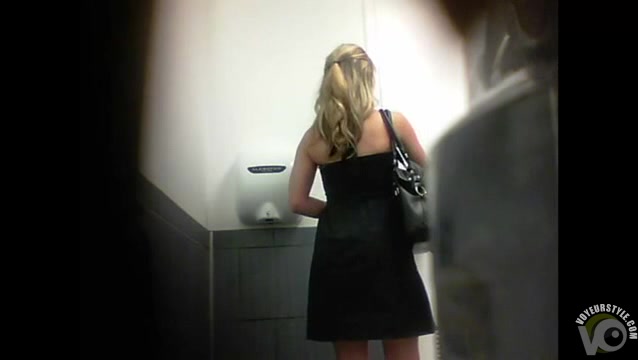 Cute Russian blonde in short dress pisses in the toilet