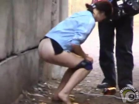 Cutie pissing in an alley as her man waits