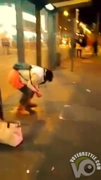 Wicked homeless woman urinates at the crowded place
