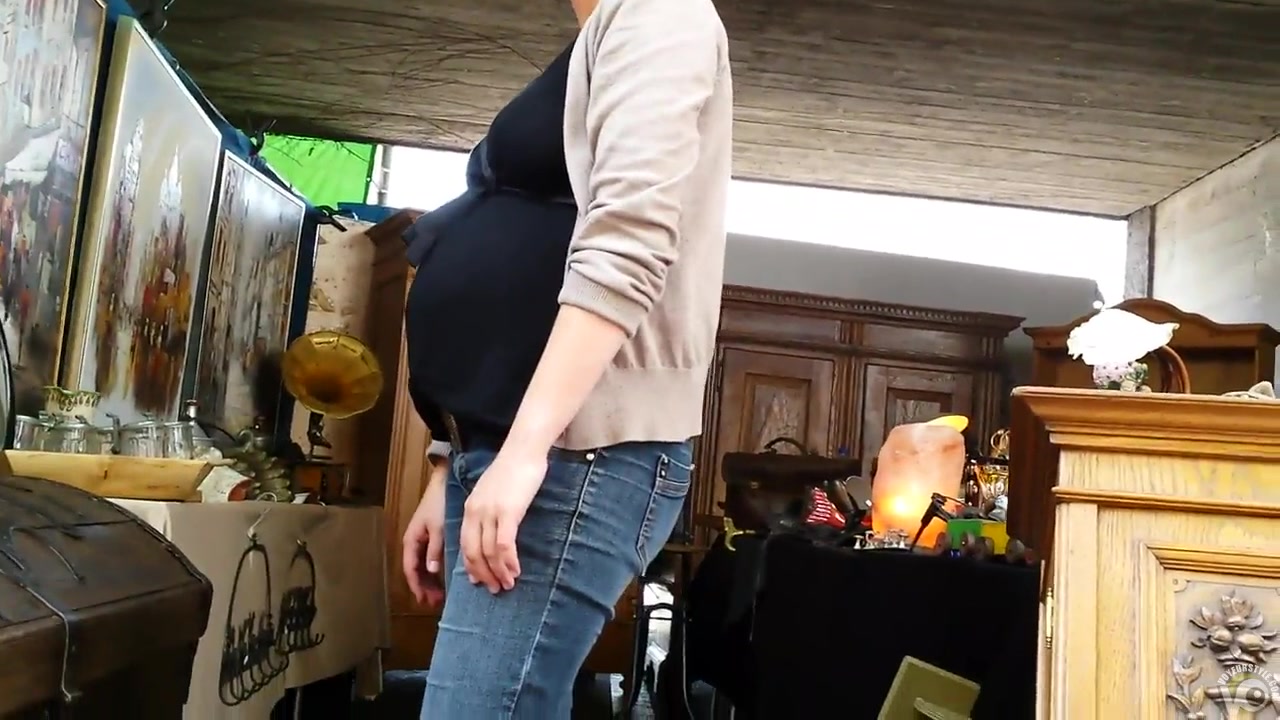 Pregnant girl cleans around the house and has her cleavage shown