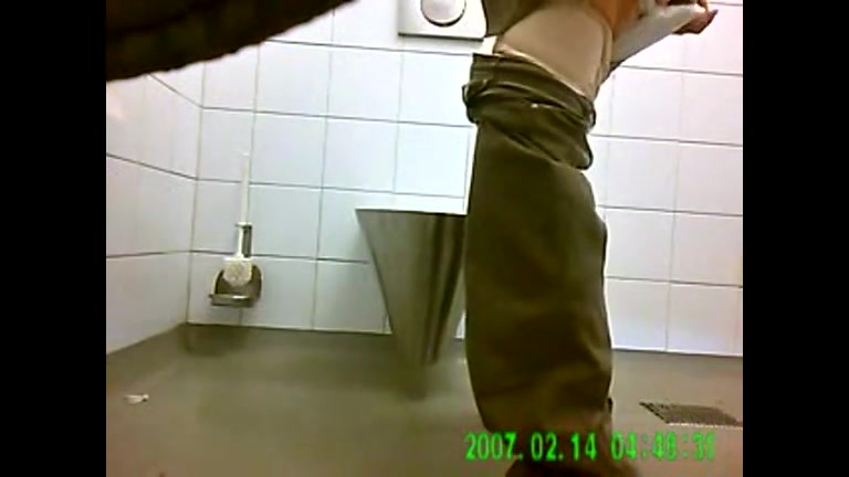 Squatting ladies pee in a public toilet