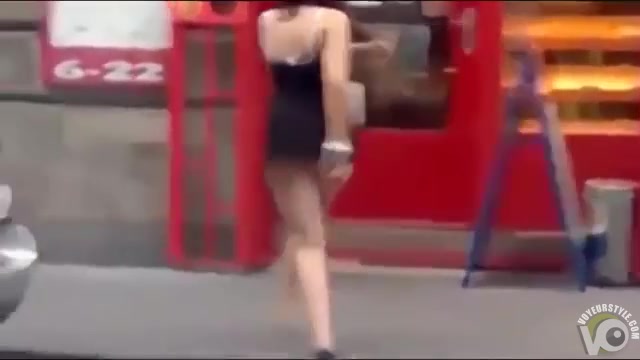 Drunk woman lifts up her skirt and brakes the door glass with her foot