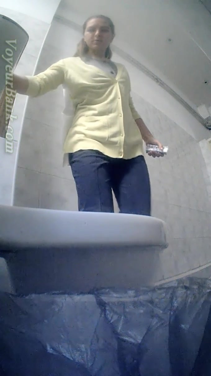Fine white chick climbs on a shitter to piss and gets filmed on hidden cam