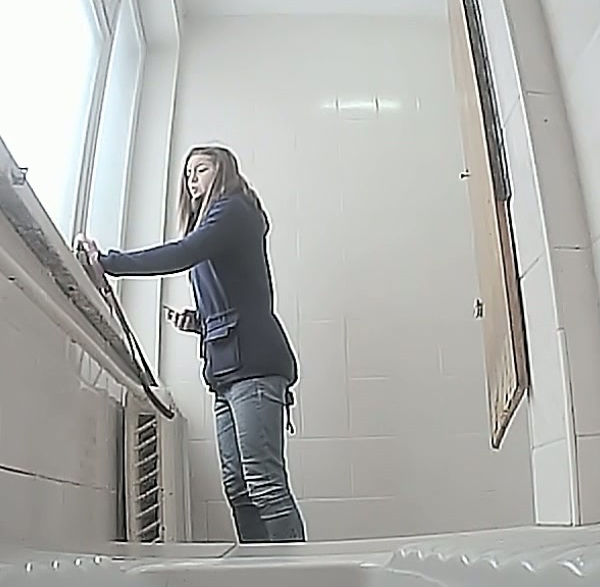 Brunette young white chick in the toilet pisses on hidden cam