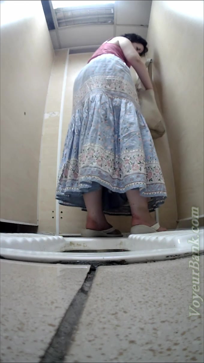 White mature lady in dress pisses in the toilet room